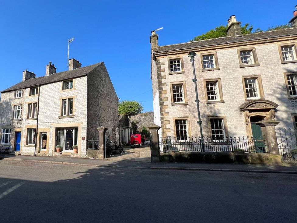 A street with stone and brick houses at Billy Whiskey's, Tideswell