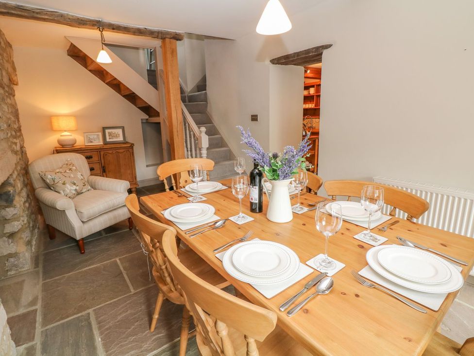 A dining room with a table set for dinner at Billy Whiskey's Tideswell