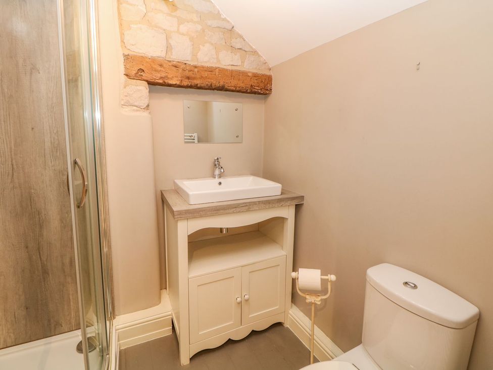 A bathroom with a sink and a shower at Billy Whiskey's Tideswell