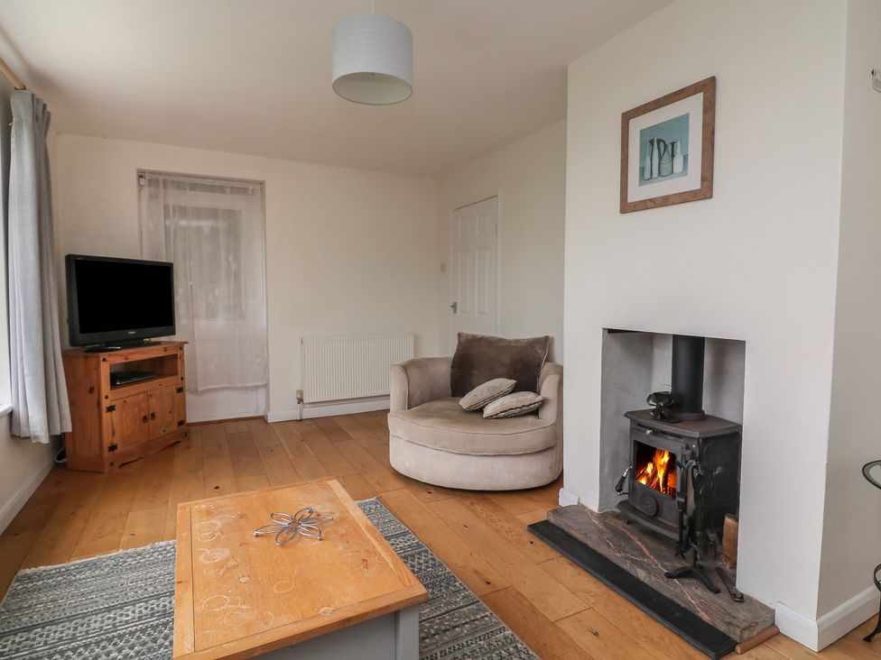 A living room with a sofa and coffee table at Tapps Lodge Plymouth