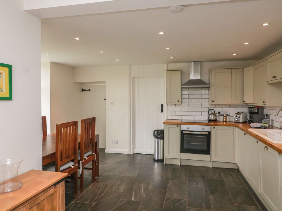 A kitchen with counter space and dining area at Tapps Lodge in Plymouth