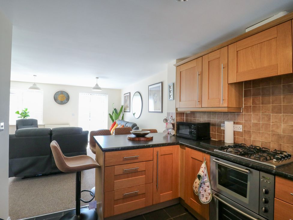 A kitchen with cabinets and stove at Gem Relax 