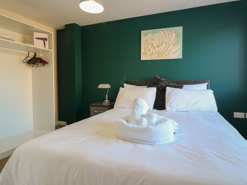 A bedroom with a bed and wardrobe at Gem Relax