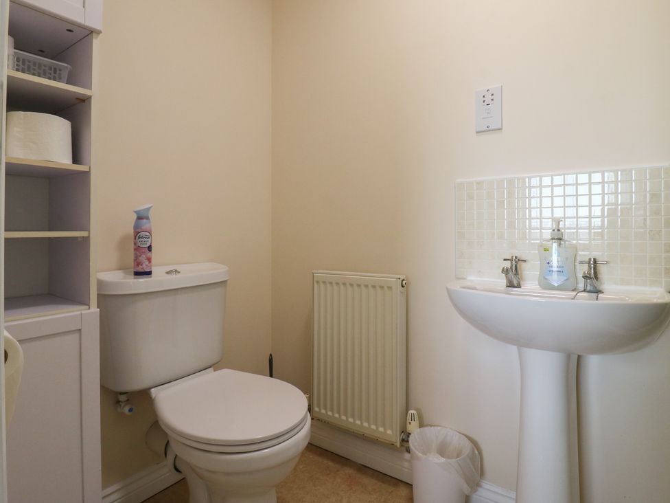 A bathroom with a toilet and sink at Gem Relax