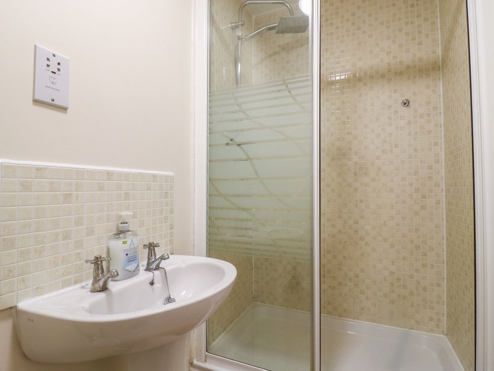 A bathroom with sink and shower at Gem Relax