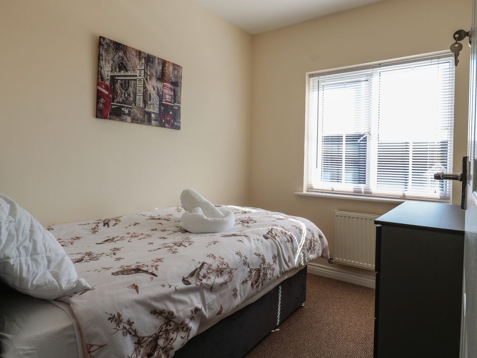 A bedroom with a bed and window at Gem Relax