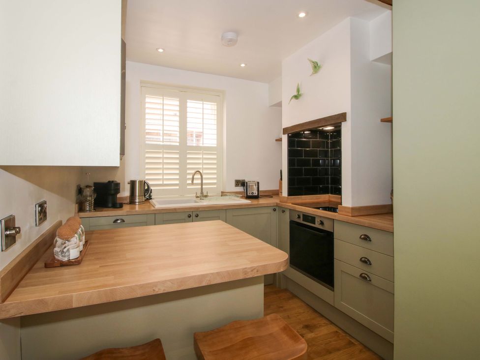 A kitchen with a countertop and oven at Raven Lane Retreat Ludlow