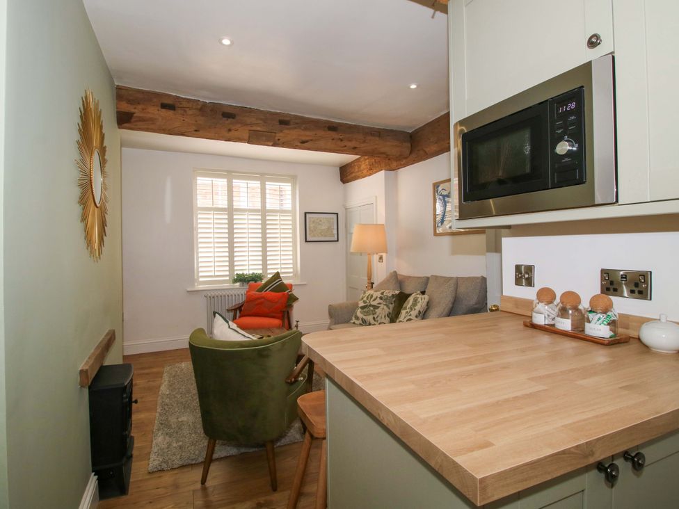 A living room with a sofa and chair at Raven Lane Retreat in Ludlow