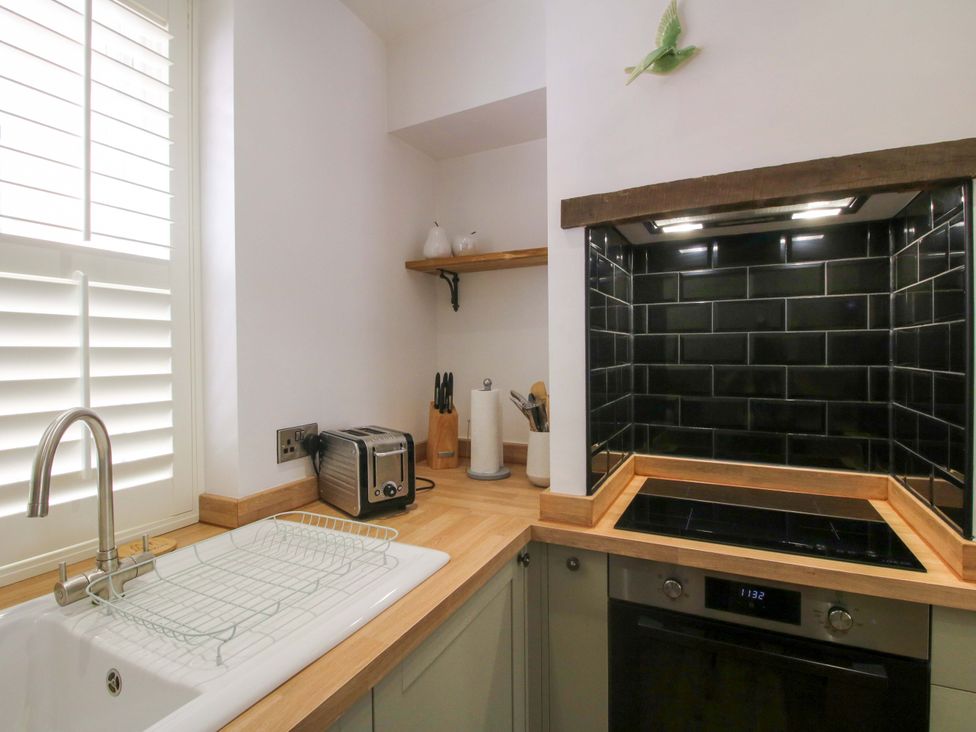 A kitchen with a sink and appliances at Raven Lane Retreat in Ludlow