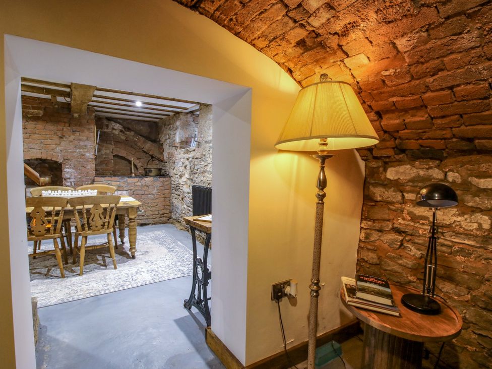 A dining room with a table and chairs at Raven Lane Retreat in Ludlow