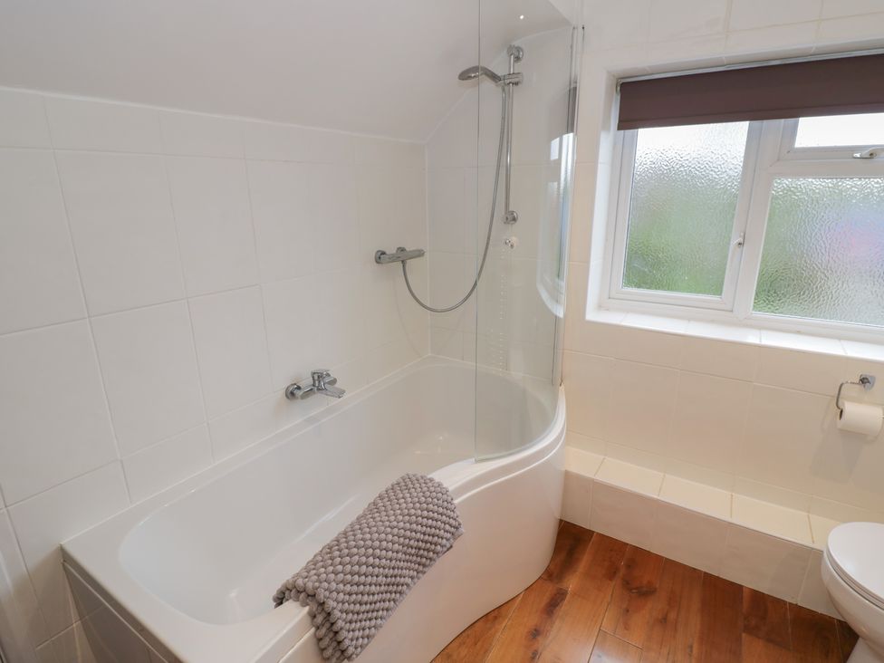 A bathroom with a bathtub and shower at Harran in Pershore