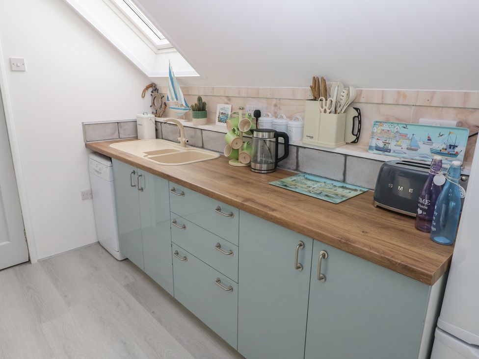 A kitchen with a sink and kettle at Over the way in Cosheston near Pembroke