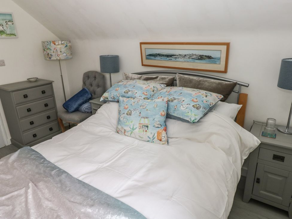 A bedroom with a bed and accessories at Over the way Cosheston near Pembroke