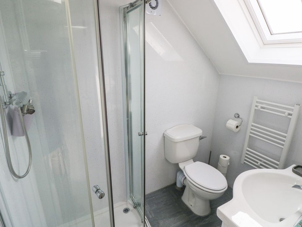 A bathroom with shower, toilet, and sink at Over the way Cosheston near Pembroke