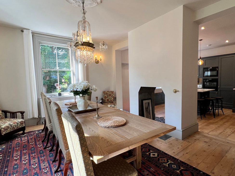 A dining room with a table and chairs at Your Country House in Reading