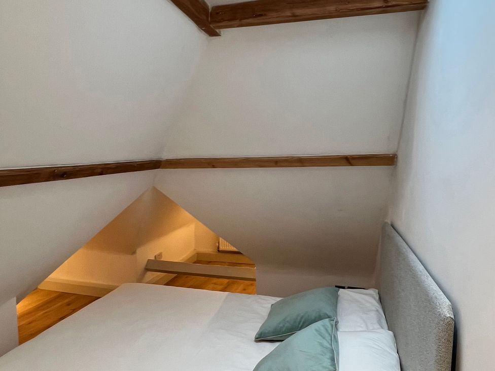 A bedroom with a bed and pillows at Your Country House in Reading