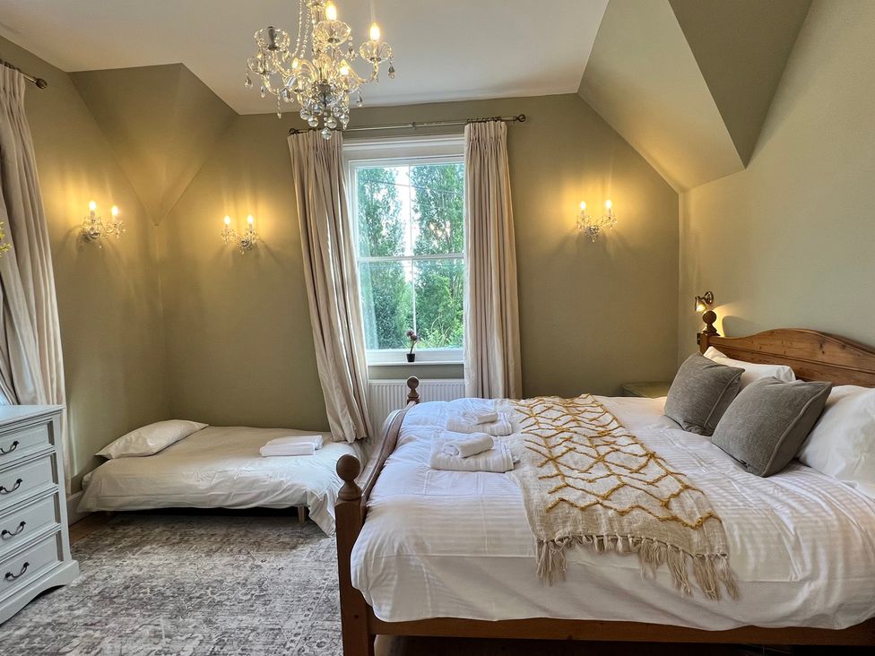 A bedroom with a bed and window at Your Country House, Reading