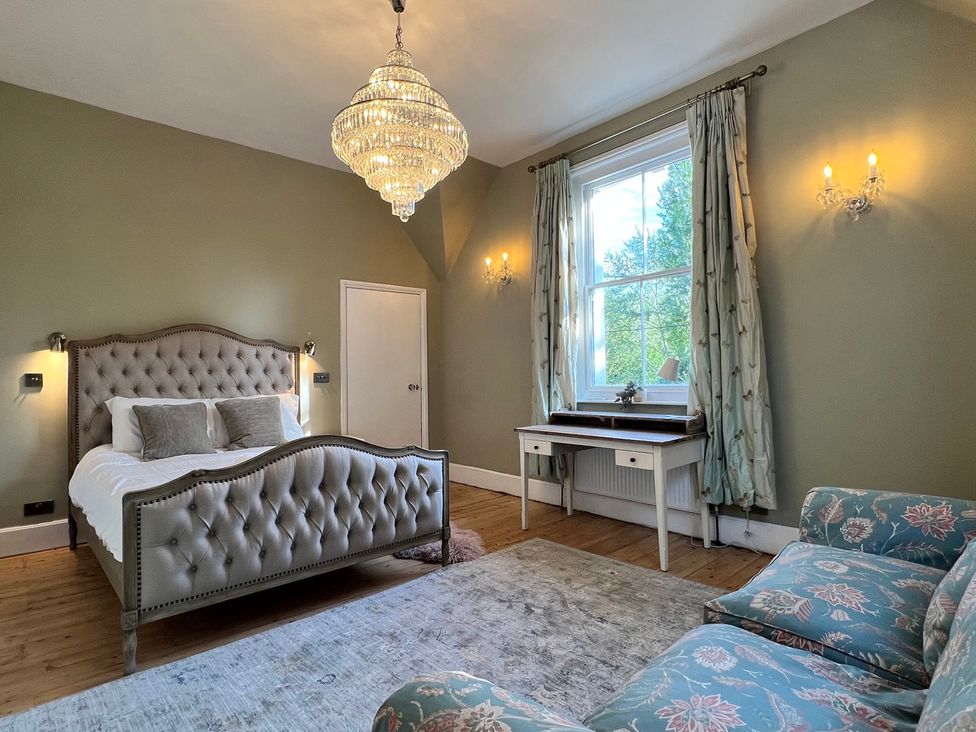 A bedroom with a bed and a desk at Your Country House Reading