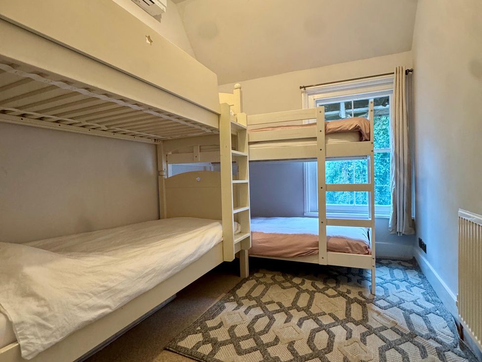 A bedroom with bunk beds and a single bed at Your Country House in Reading