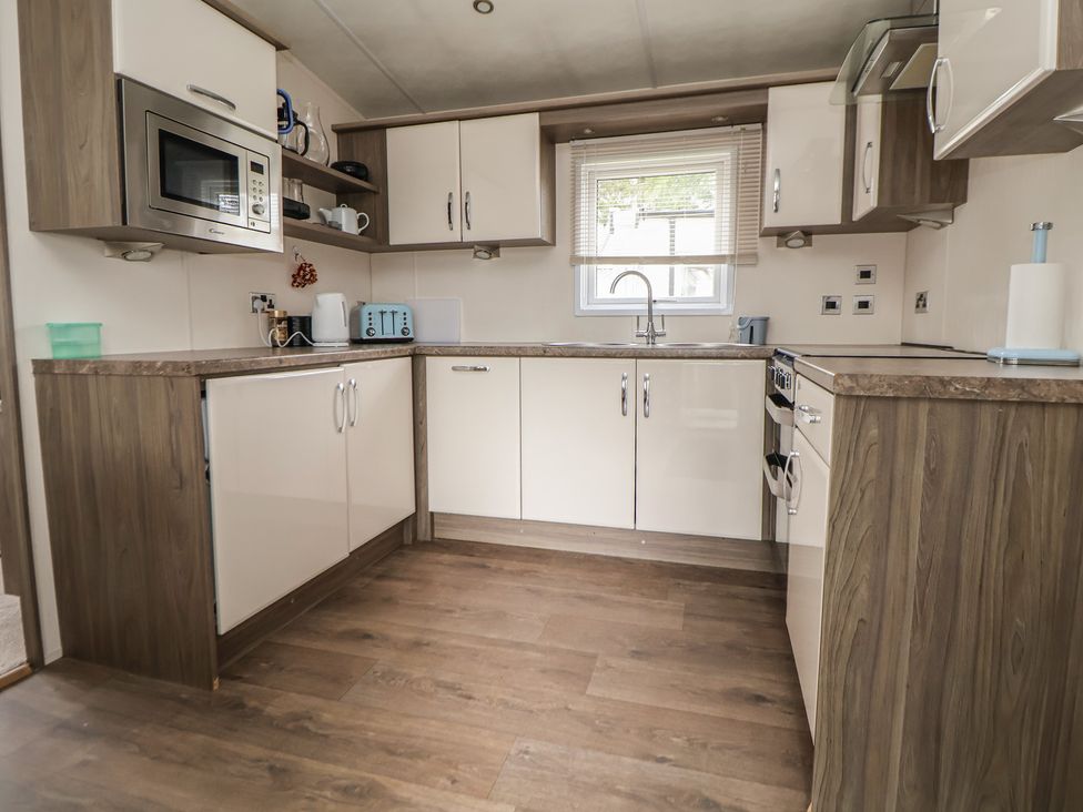 A kitchen with cabinets and appliances at Delta Superior in 
