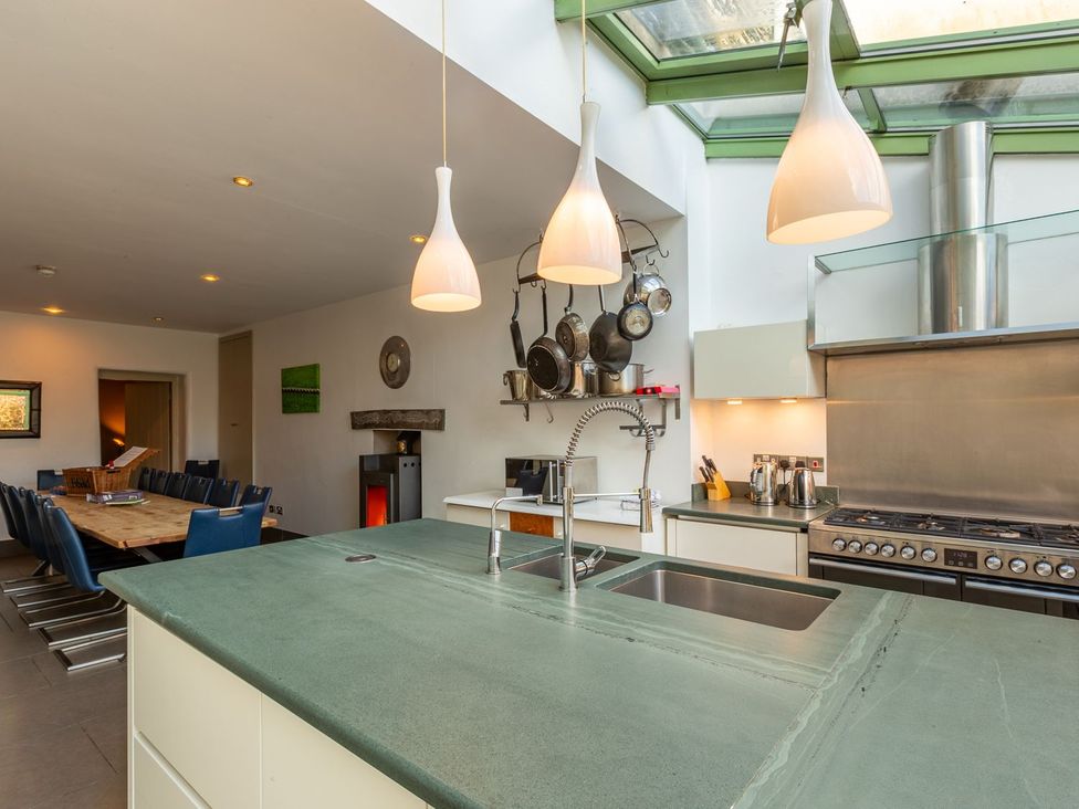 A kitchen with a large island and dining area at The Boundary in Windermere