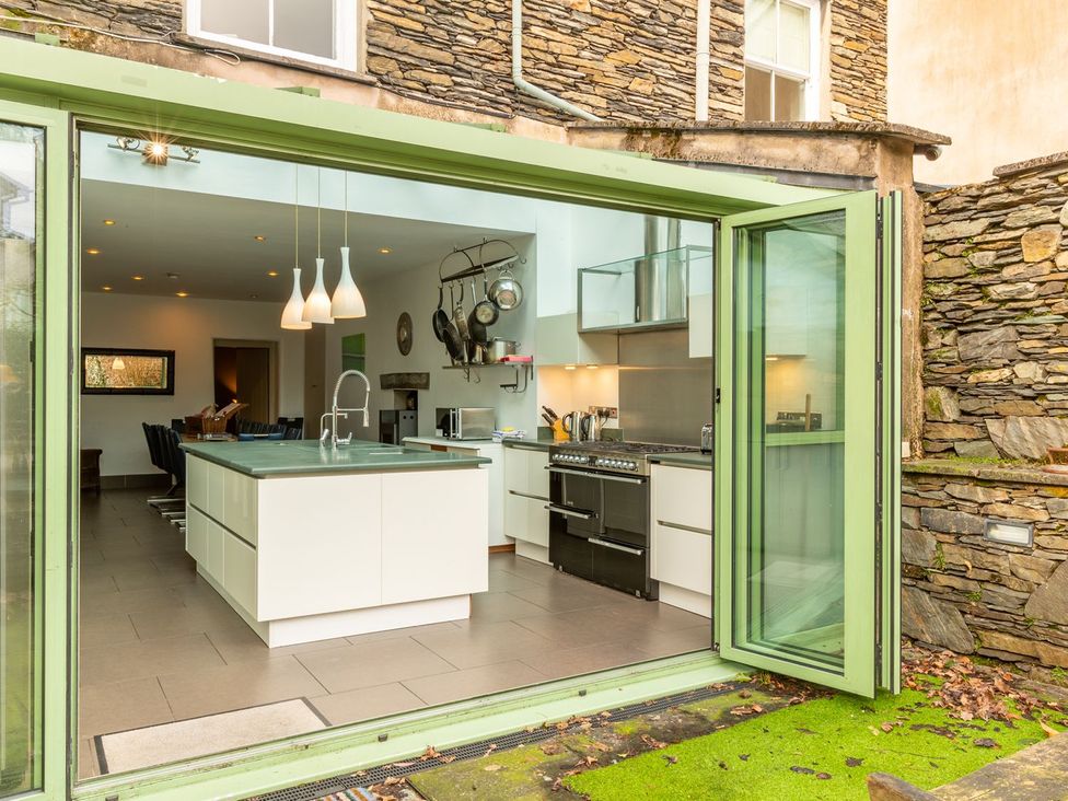 A kitchen with an island and appliances at The Boundary in Windermere