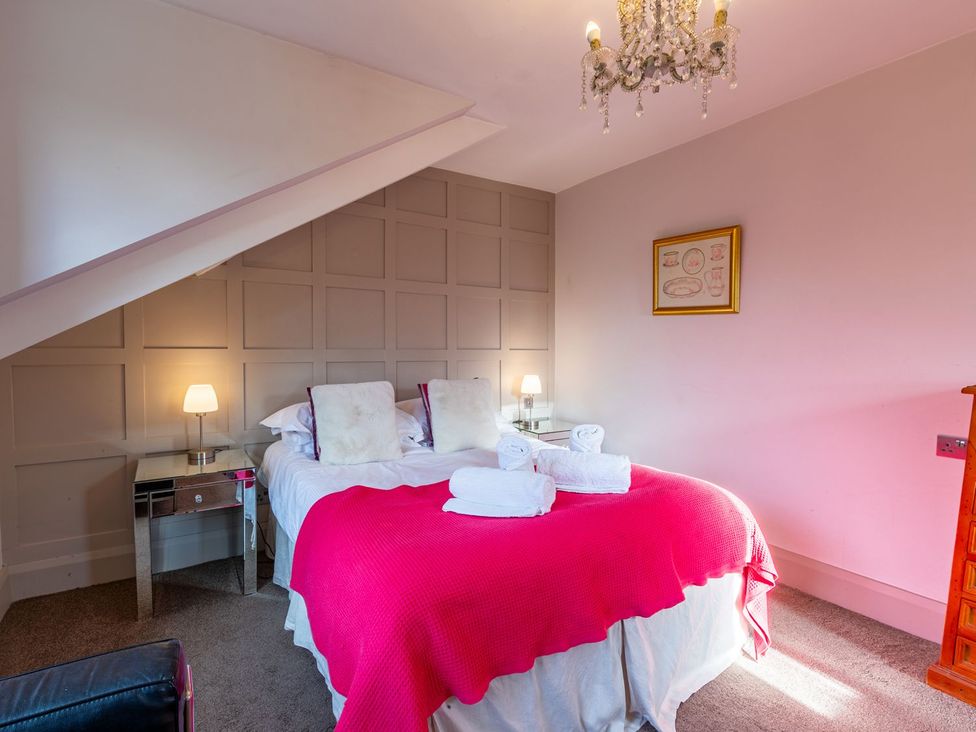 A bedroom with a bed and bedside table at The Boundary in Windermere