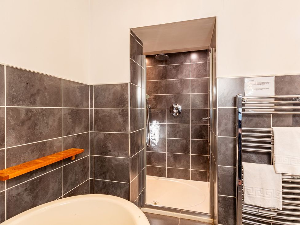 A bathroom with a bath tub and shower at The Boundary in Windermere