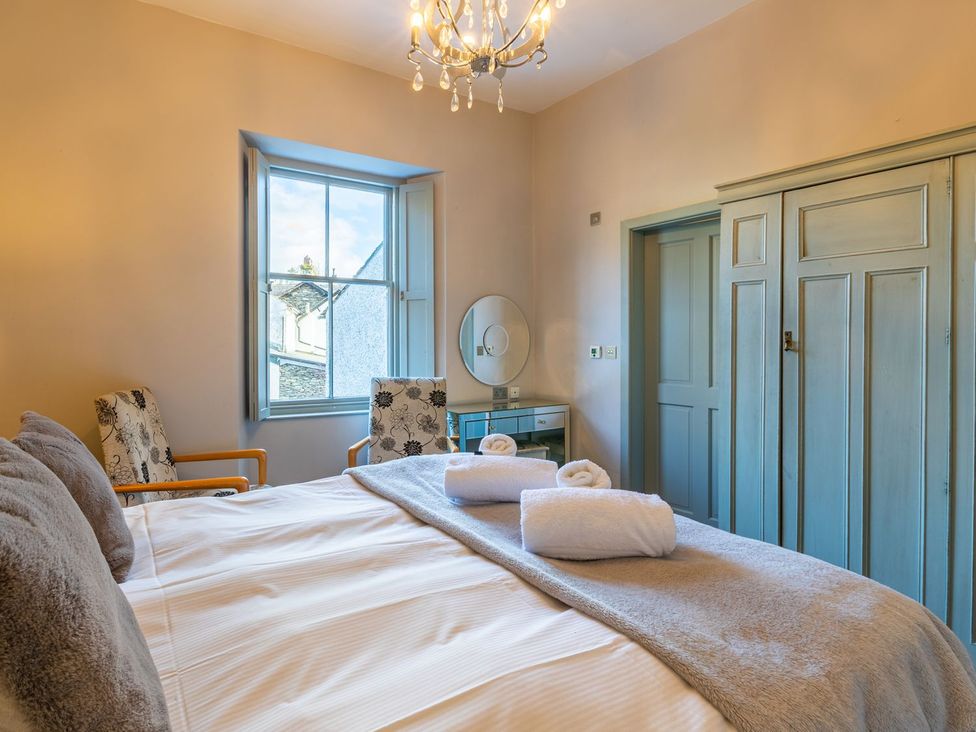 A bedroom with a bed and window at The Boundary in Windermere