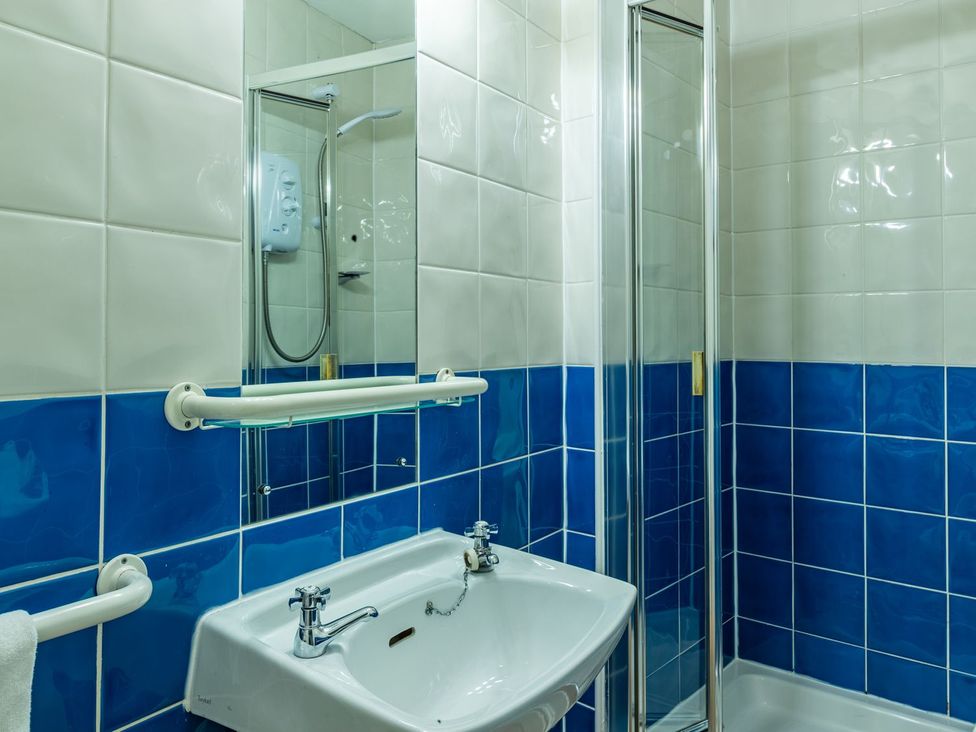 A bathroom with a sink and shower at The Boundary Windermere