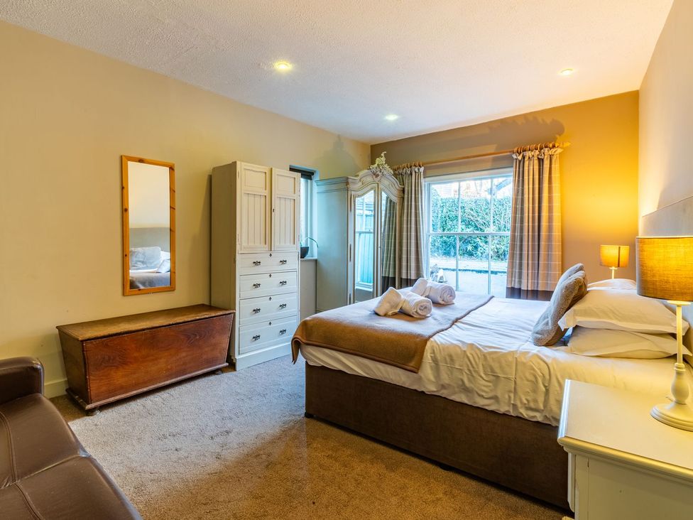 A bedroom with a bed and dresser at The Boundary in Windermere