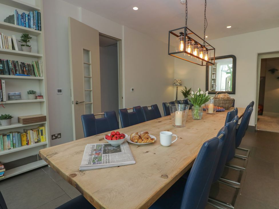 A dining room with a large table and chairs at The Boundary in Windermere