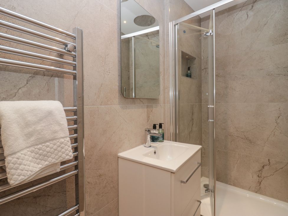 A bathroom with a shower and sink at The Boundary in Windermere