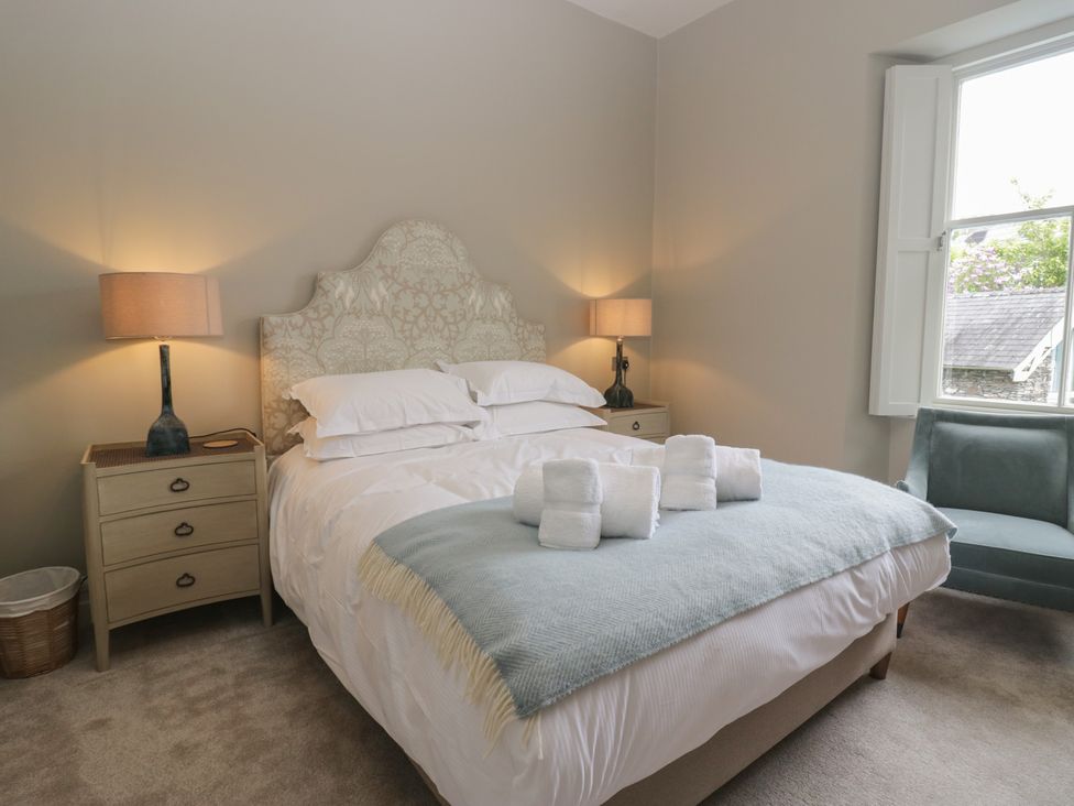 A bedroom with a bed and bedside tables at The Boundary in Windermere