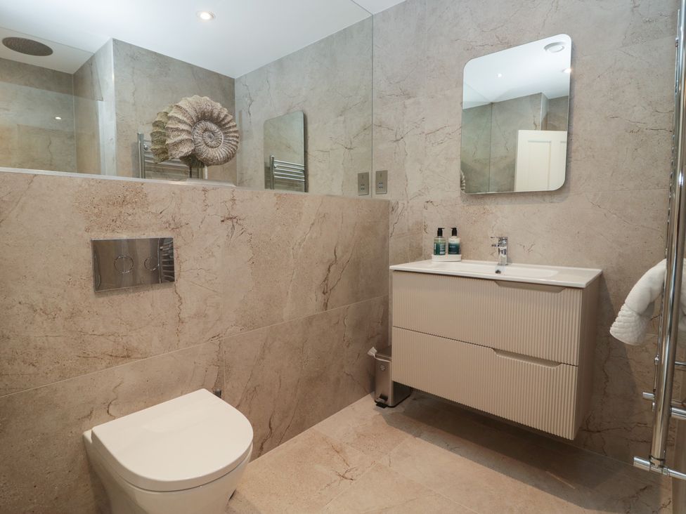 A bathroom with a toilet and wash basin at The Boundary in Windermere