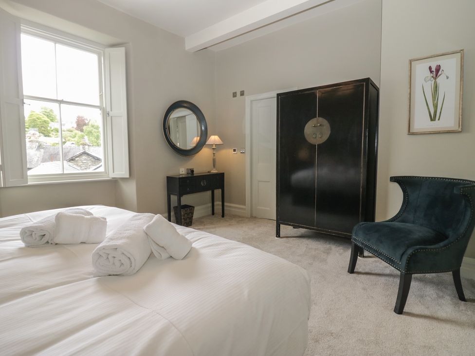 A bedroom with a bed and window at The Boundary in Windermere