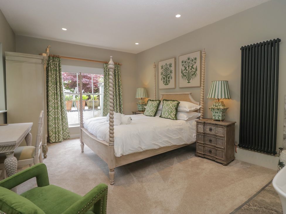 A bedroom with a bed and bedside table at The Boundary in Windermere