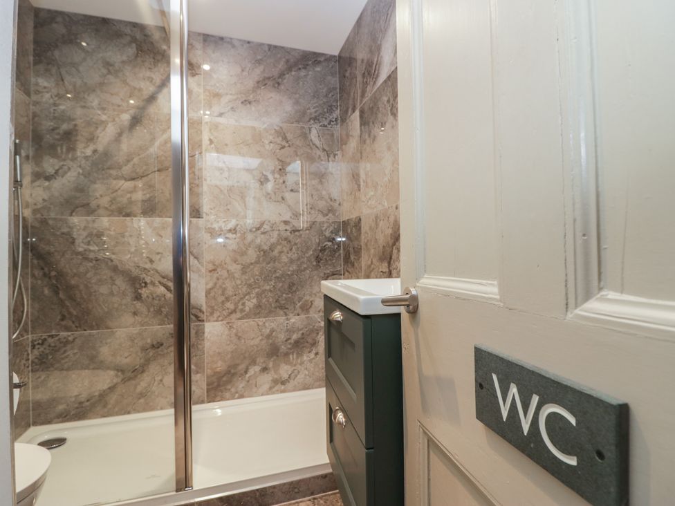 A bathroom with a shower and sink at The Boundary in Windermere