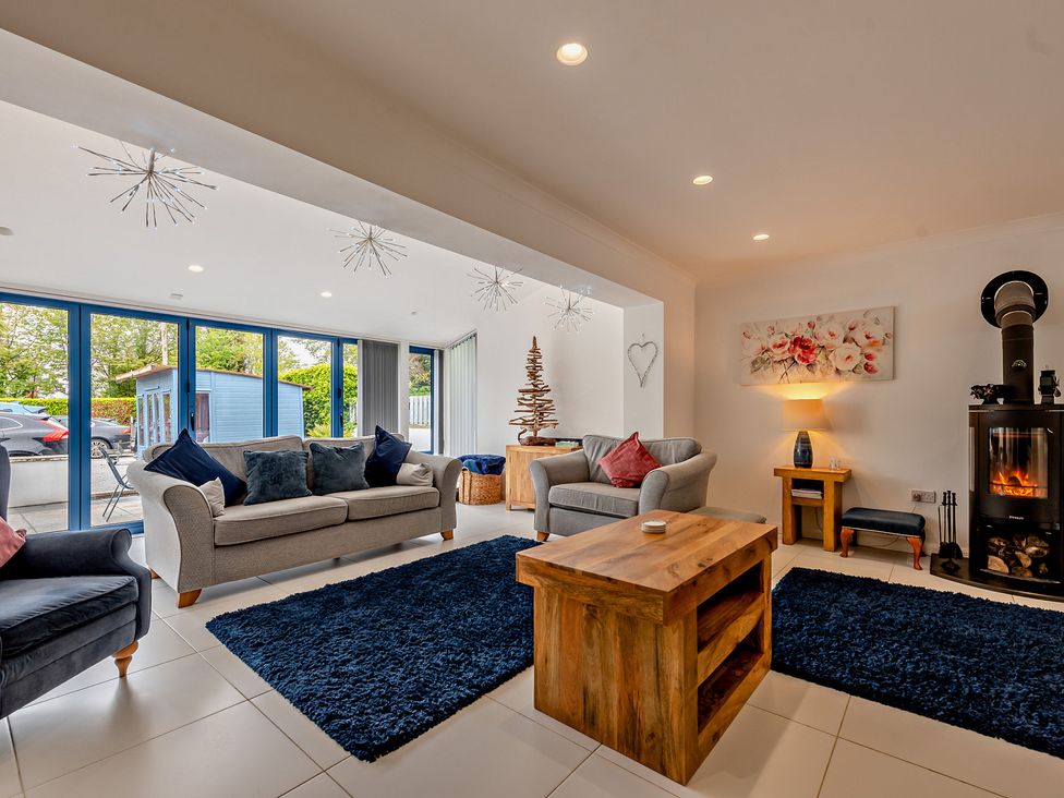 A living room with sofas and a coffee table at Sea Haze in Tenby