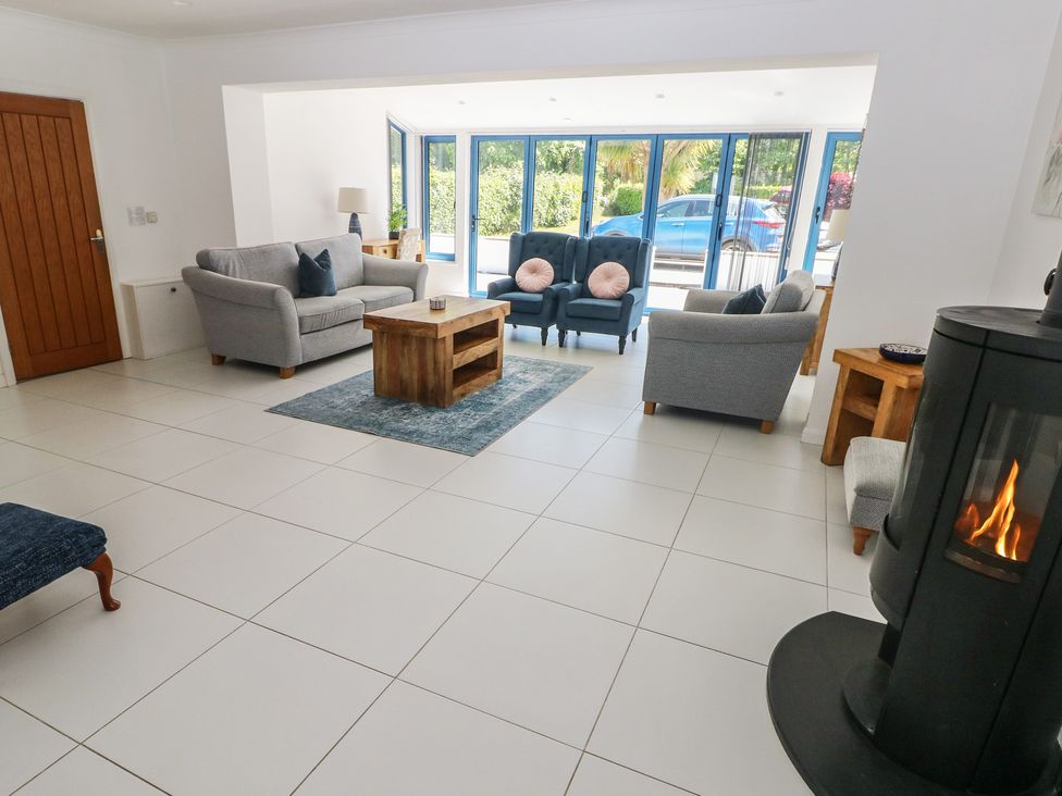 A living room with sofas and a coffee table at Sea Haze in Tenby