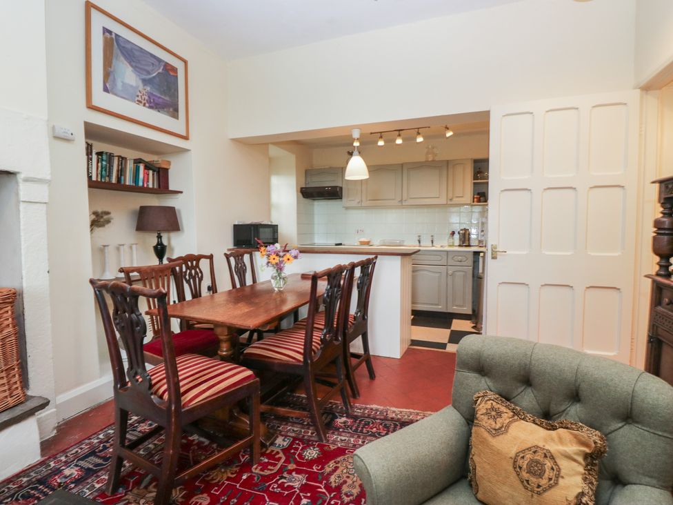 A dining room with a table and chairs at The Old Kitchen in Cartmel