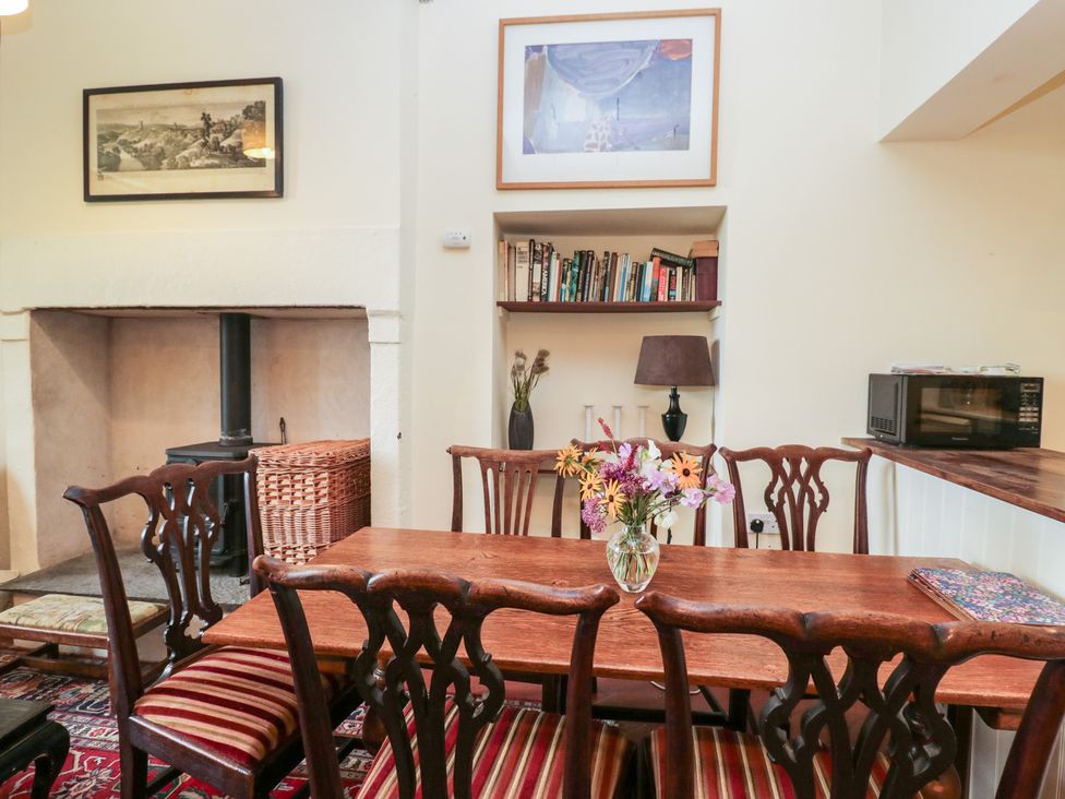 A dining room with a table and chairs at The Old Kitchen in Cartmel