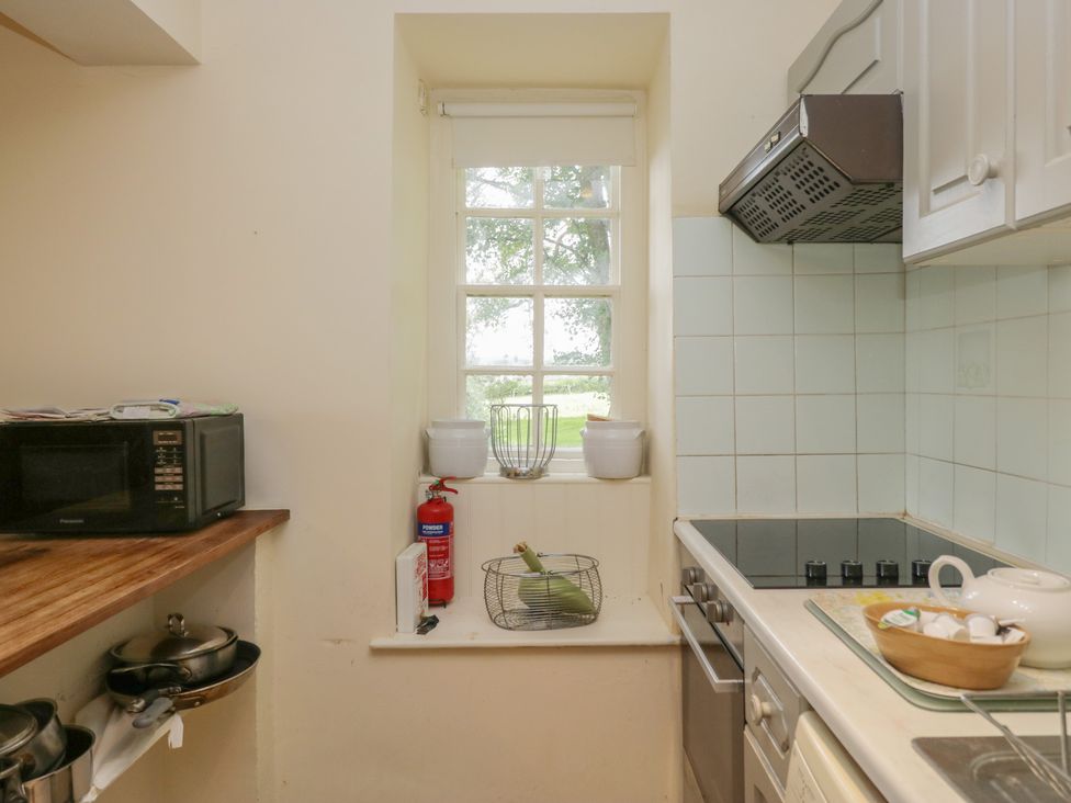 A kitchen with appliances and cookware at The Old Kitchen in Cartmel