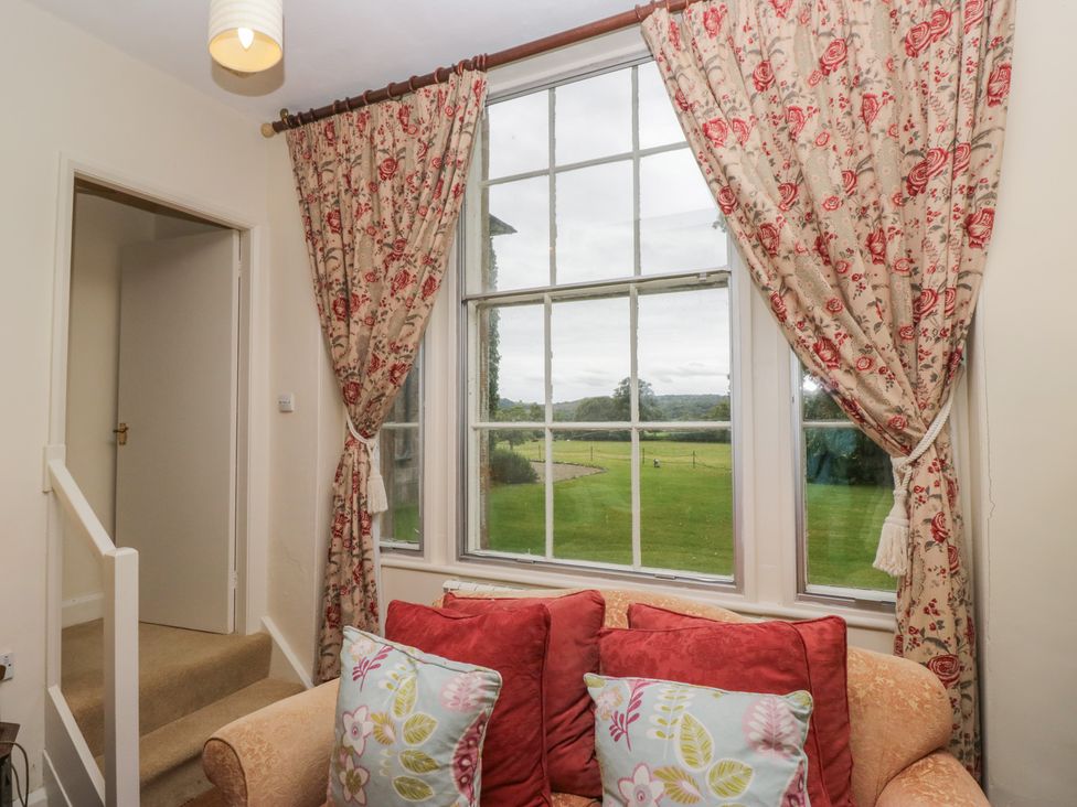 A living room with a window and sofa at The Old Kitchen in Cartmel