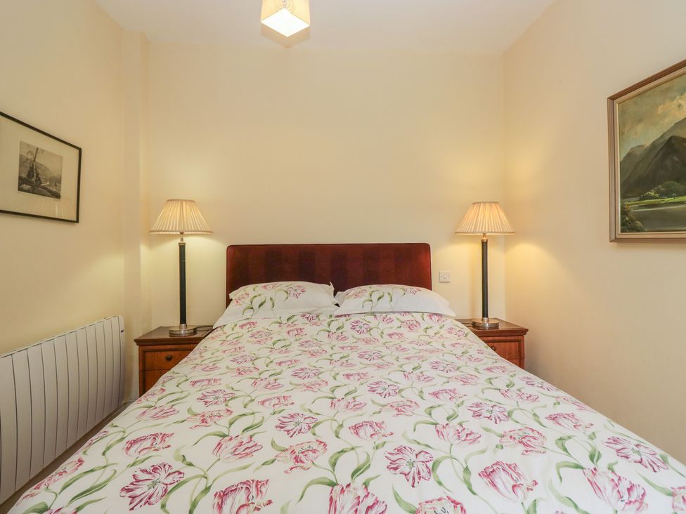 A bedroom with a bed and bedside tables at The Old Kitchen in Cartmel