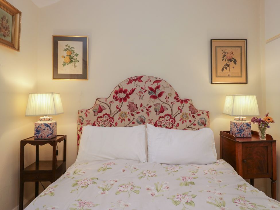 A bedroom with a bed and bedside tables at The Old Kitchen in Cartmel
