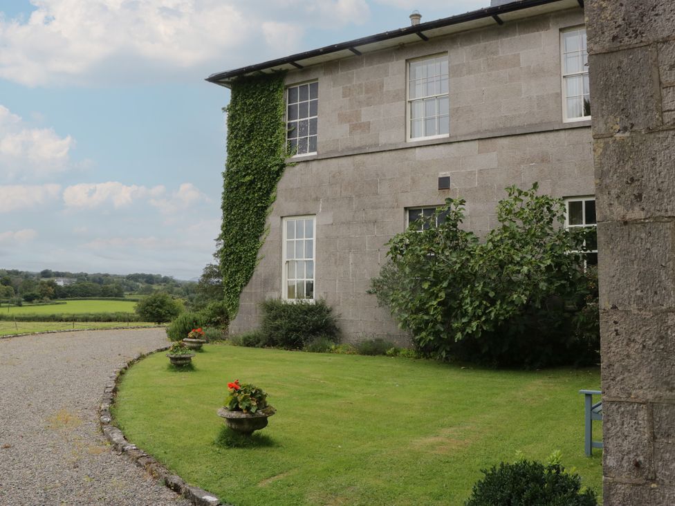 A building with windows and grass area at The Old Kitchen in Cartmel