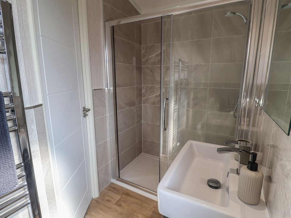 A bathroom with a shower and sink at Lodge 1 Norwich
