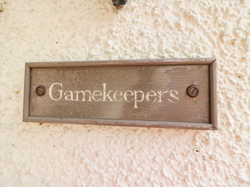 A sign that reads Gamekeepers at The Gameskeepers Cottage in Cartmel