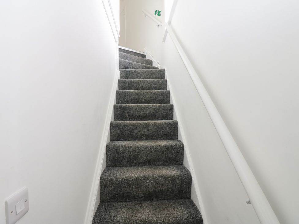 A staircase leading upwards at Salvin Cottage in Alston